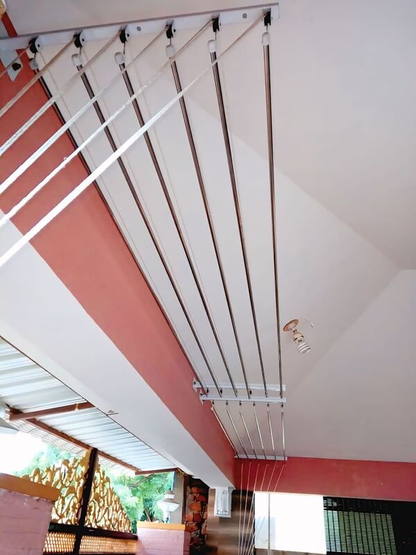 Cloth hangers installed on apartment balcony in Bangalore - laundry drying system by Tharak Enterprises